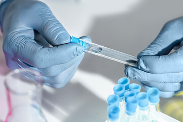 Water sample sealed in a test tube in a scientific laboratory, environmental water quality monitoring and chemical analysis for contamination and safety control. © TSViPhoto