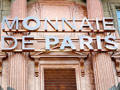 Giant letters spelling "MONNAIE DE PARIS" on the building's facade in Paris, France