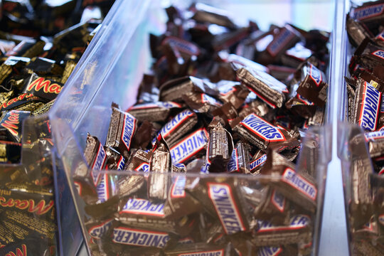 Tyumen, Russia-March 20, 2026: Snickers chocolate candies with shallow depth of field, highlighting the iconic logo