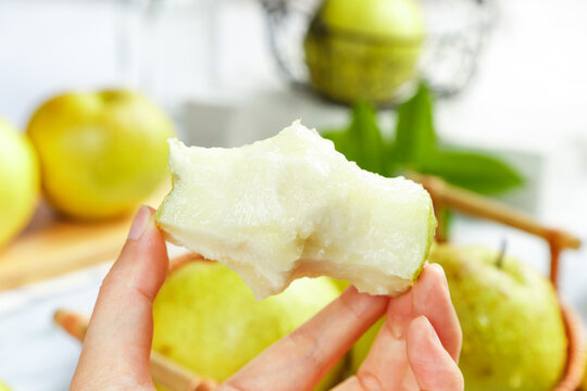 Fresh Yellow Pear Cut in Half with Juicy White Flesh