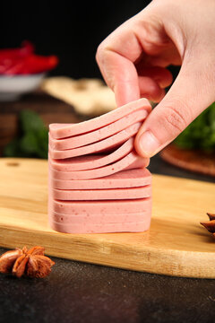 Sliced Pork Meat Preparation on Wooden Board