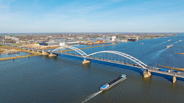 Highway traffic on a bridge across a wide river in Europe