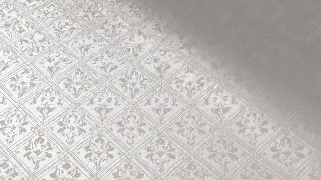 Elegant embossed damask pattern on a textured surface with soft light casting subtle shadows and highlights