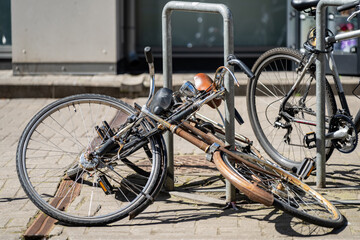 Obraz premium Two distinct bicycles parked at an outdoor city street station highlighting urban micro-mobility, green transit, and everyday lifestyle