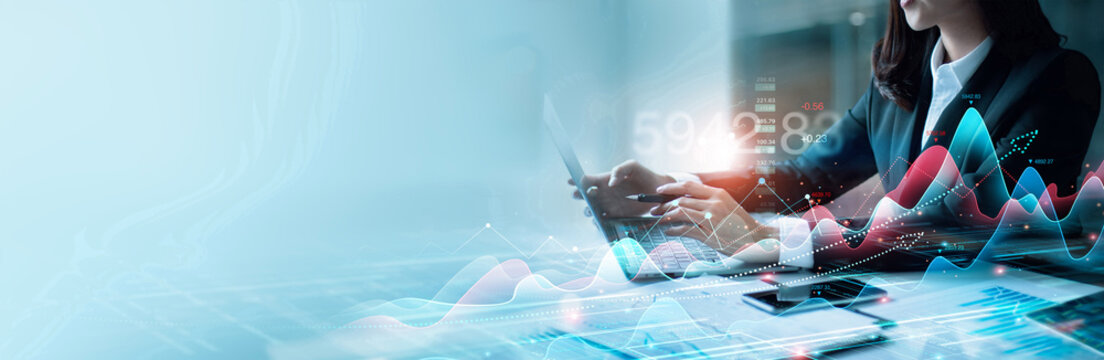 Businesswomen analyzing and calculating financial data for long term investment growth goals and company finance balance, Stock, Business strategy and planning. Analytics of Digital marketing.