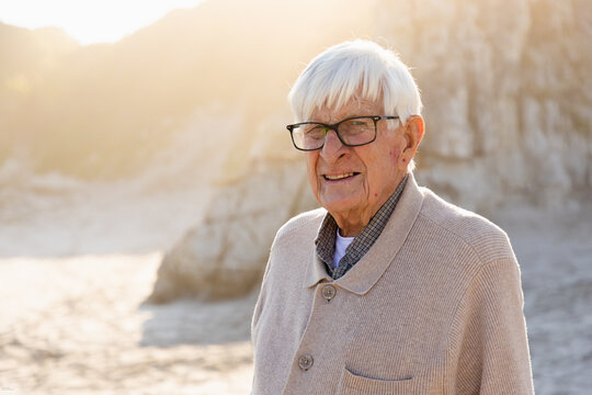 elderly man enjoying beach time, misty grotto beach, hermanus, South Africa