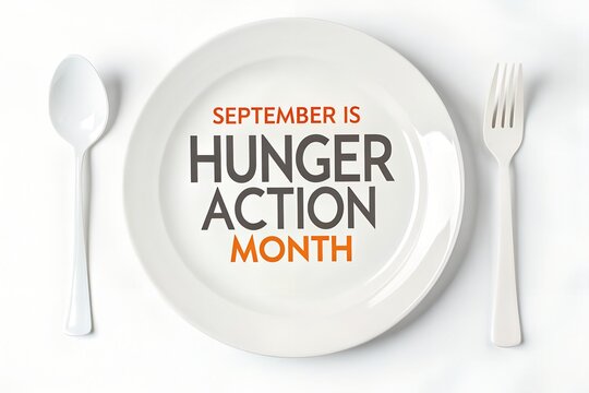 Empty white ceramic dinner plate with a spoon and fork placed neatly on a clean table surface featuring bold dark grey and orange text promoting September is hunger action month