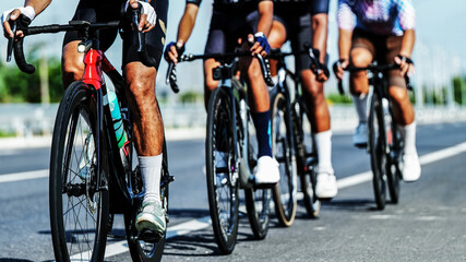 Naklejka premium Road Cyclists Training Together on Open Road