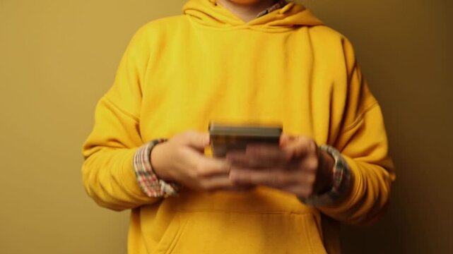 Person shaking glitchy frozen smartphone close up. Shaking phone due to system lag, application error, device freeze or slow internet connection, technology frustration concept