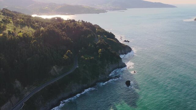 Surfer Riding Ocean Waves in Slow Motion on the Coast of Northern Spain