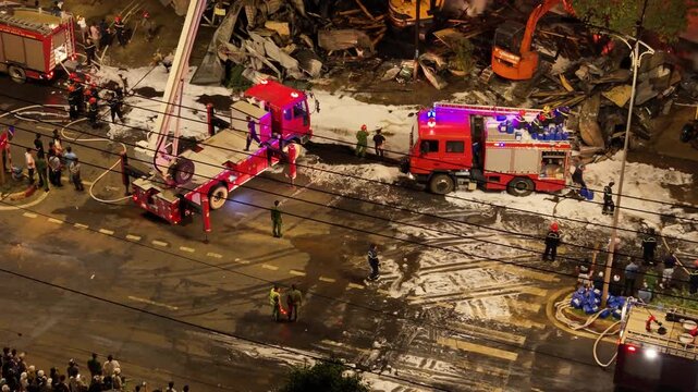 Telephoto Drone View of Fire Trucks and Emergency Operations on Foam Covered Highway in Buon Ma Thuot, Dak Lak, Vietnam