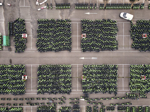 Middenmeer, Netherlands - 15 June 2026: Aerial view of thousands of GO Sharing electric scooters parked in dense blocks at a depot in Agriport after the company's business failure.
