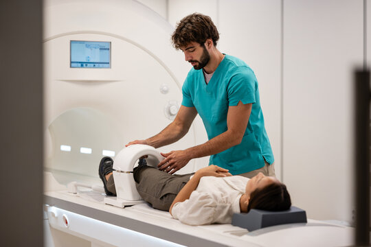 Medical professional preparing patient for mri scan