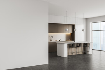 Naklejka premium Modern interior kitchen with spacious empty wall for poster mockup in bright minimal design featuring sleek cabinetry, island seating and soft lighting. 3D Rendering