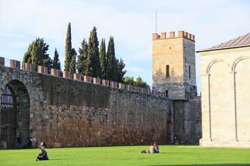 Pisa Medieval Fortress Walls and Tower with Lawn Square © TrinhVan