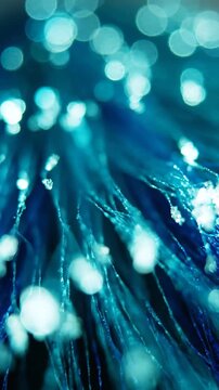 A Mesmerizing Close-Up of Fiber Optic Cables with Ethereal Blue Glow and Sparkling Bokeh Lights Creating a Magical and Futuristic Atmosphere