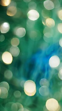 A Captivating Display of Green and Blue Swirls with Bokeh Effects Illuminated in Sparkling Light, Creating an Enchanting Visual Experience