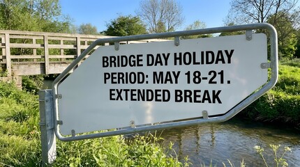 Bridge Day Holiday Sign Near Stream Symbolizing Extended Weekend and Vacation Planning
