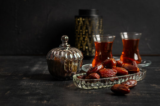 Dates and Turkish Tea on Dark Background