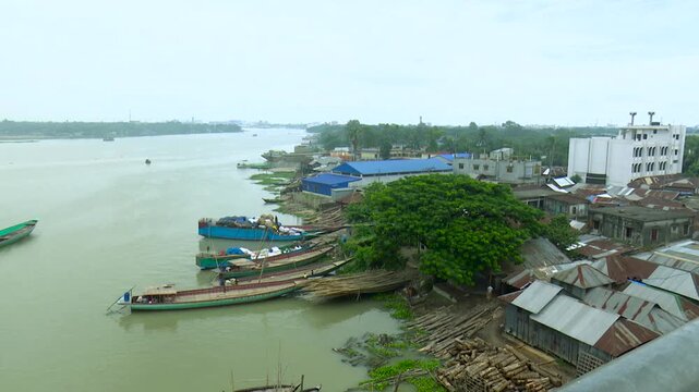 Industrial Skyline and River Traffic on the Shitalakshya River Bangladesh