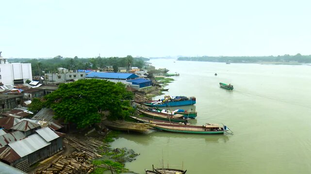 Wide View of Boats and Riverside Facilities Along the Shitalakshya River