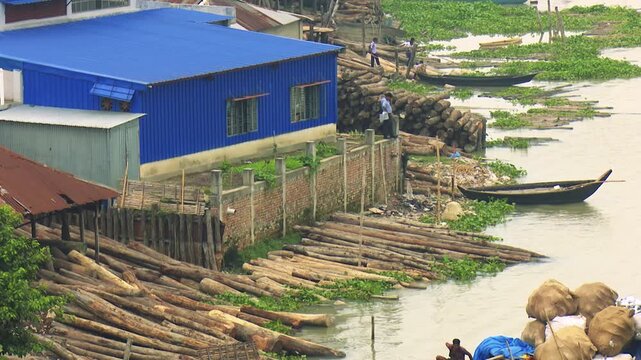 Blue Industrial Building Overlooking the Shitalakshya River in Bangladesh