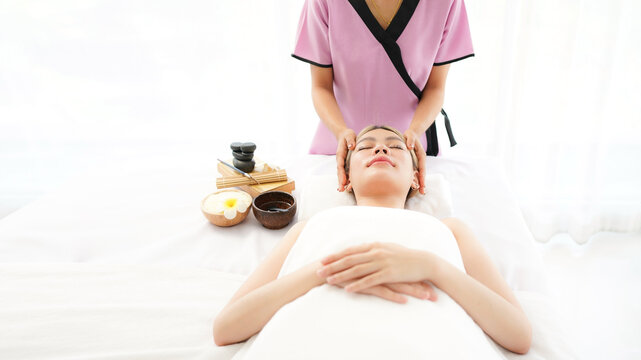 Woman spa body and face treatment and massage aroma therapy product relax and healthy and beauty. Spa Thai therapy treatment aromatherapy for body and face. Young woman enjoying and relax massage 