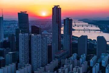 Fototapeta premium Stunning sunset view over the Han River and Seoul skyline, featuring high-rise corporate towers in Yeouido financial district