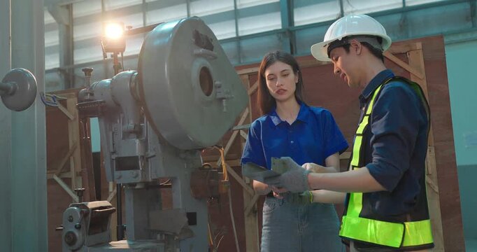 Engineer Demonstrates Product Testing Machine to Startup Entrepreneur in Small Lab Workshop