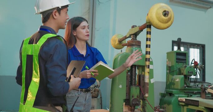 Engineer Demonstrates Product Testing Machine to Startup Entrepreneur in Small Lab Workshop