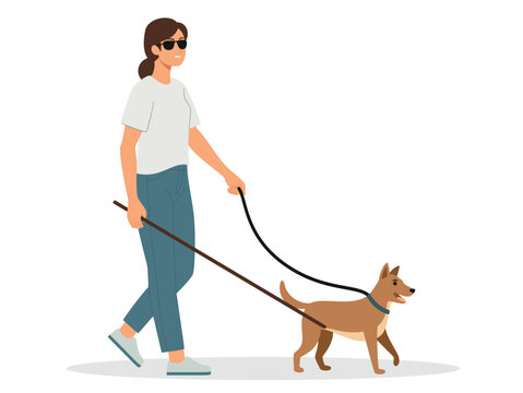 A blind woman with brown hair is walking and carrying her pet dog