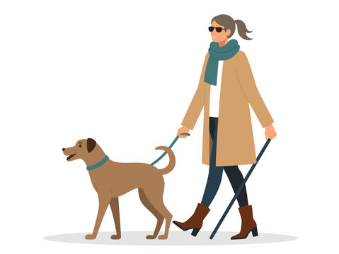 A blind woman with a green scarf is walking and carrying her pet dog