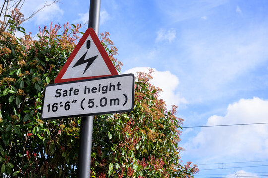 UK Safe Height Warning Sign under Blue Sky