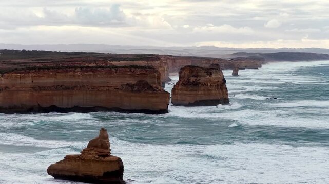 Along Twelve Apostles eroded scenic rocks off Australian coast at Great Ocean road.
