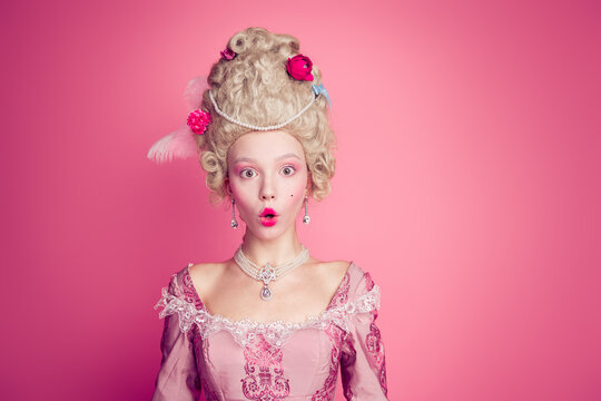 Photo of amazed court lady princess impressed wearing 18th century outfit dress isolated pastel color background