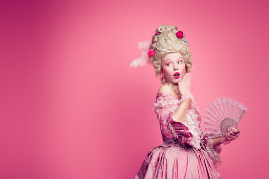 Photo of amazed noble lady impressed look empty space festival ads wear antique style clothes isolated pink color background
