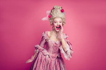 Naklejka premium Photo of excited lady in antique style costume hand shouting announcing isolated pink color background