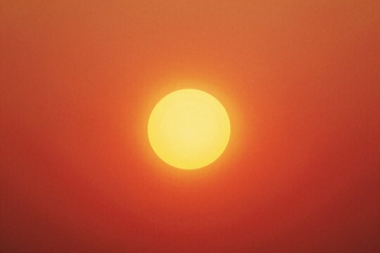 a bright orange and yellow sun on a black background