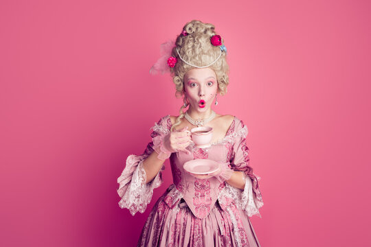 Photo of adorable impressed marie antoinette wear corset dress drinking coffee empty space isolated pink color background