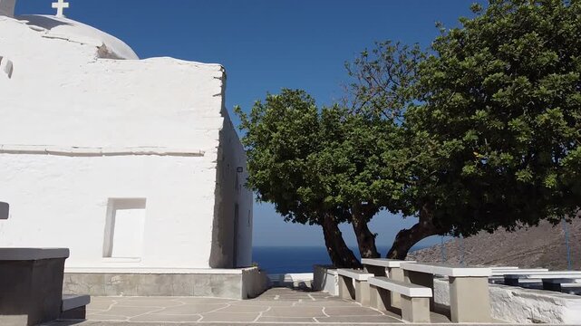 Unveiling Shot on Ios Greece, passing from a Church to the beach