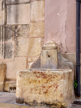 Old stone fountain in X&agrave;tiva. Xativa, J&aacute;tiva in Spanish, province of Valencia, Spain, Europe.