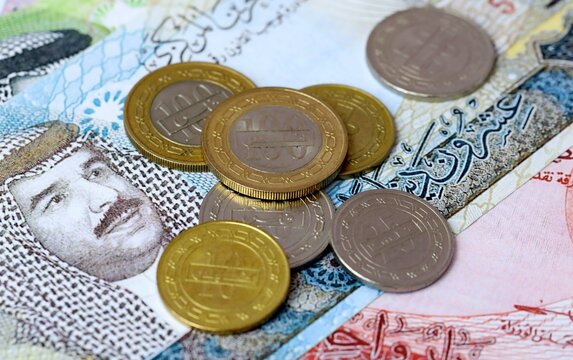 Bahraini dinar money bills and coins on table. Bahrain cash of BHD currency close up