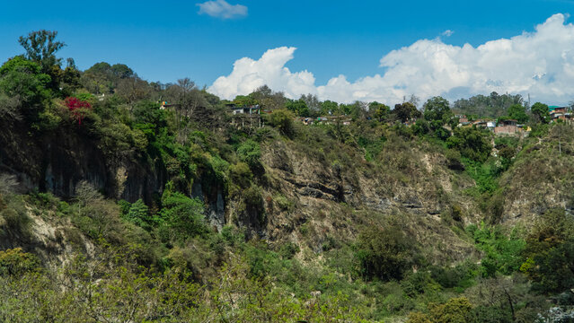 Scenic countryside cliffs under blue sky
