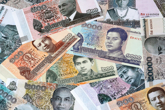 Cambodian riel money bills in pile on table. Cambodia KHR currency cash close up