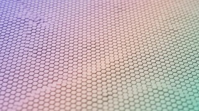 Abstract hexagonal pattern with soft pastel gradient lighting creating a futuristic and modern geometric background