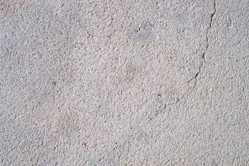 Fototapeta premium Close-up of cracked and rough concrete for overlay background.