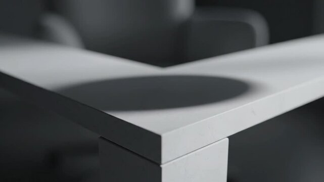 Minimalist white desk corner with soft shadow in modern office interior