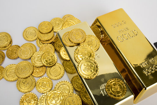 Gold bars and coins for wealth and investment concept