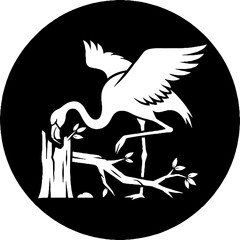 Fototapeta premium Elegant crane bird perched on a branch with leaves.