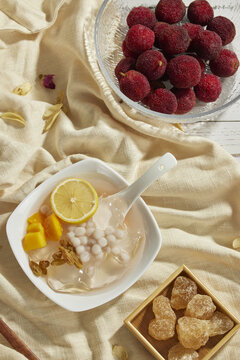 Chilled fruit dessert with lemon, mango, tapioca pearls and bayberries